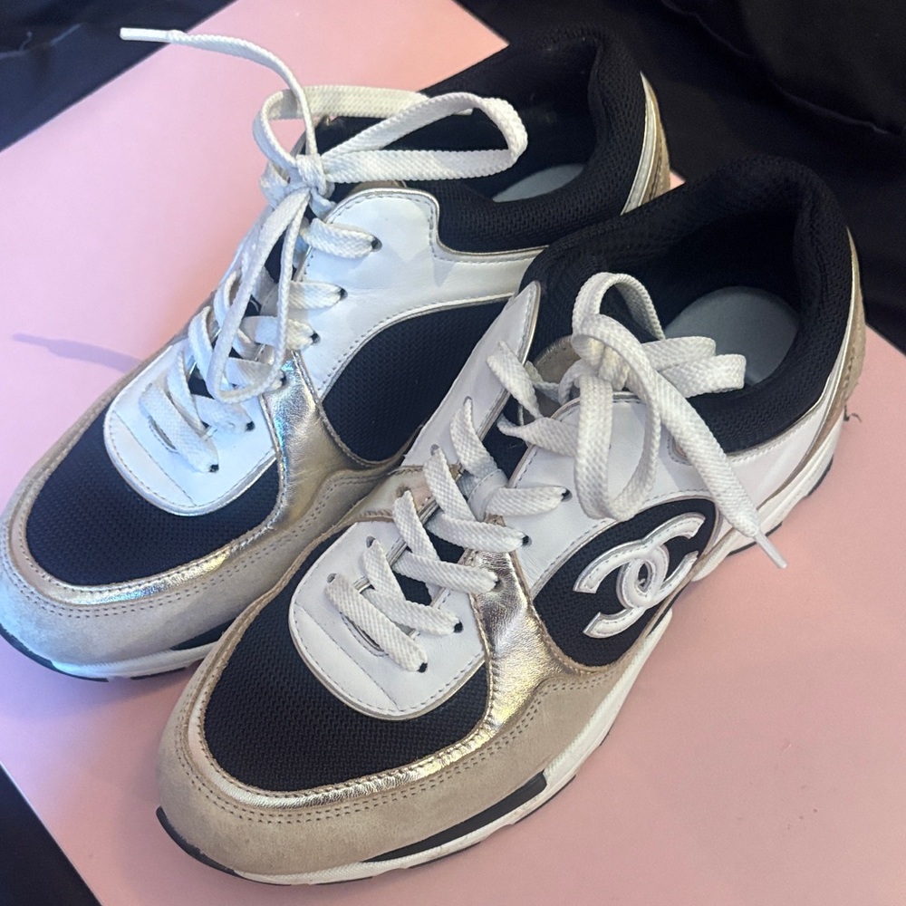 CHANEL Elegant Black, White, and Gold Sneakers for Women